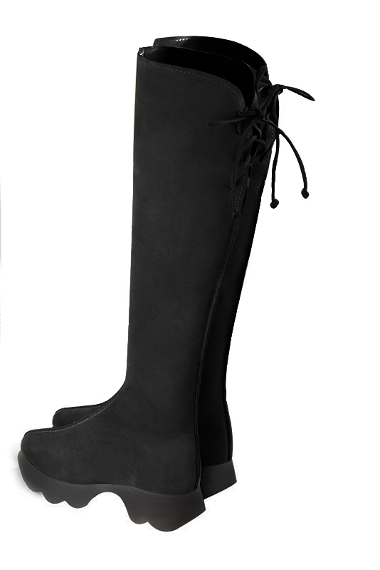 Matt black women's knee-high boots, with laces at the back. Round toe. Low rubber soles. Made to measure. Rear view - Florence KOOIJMAN